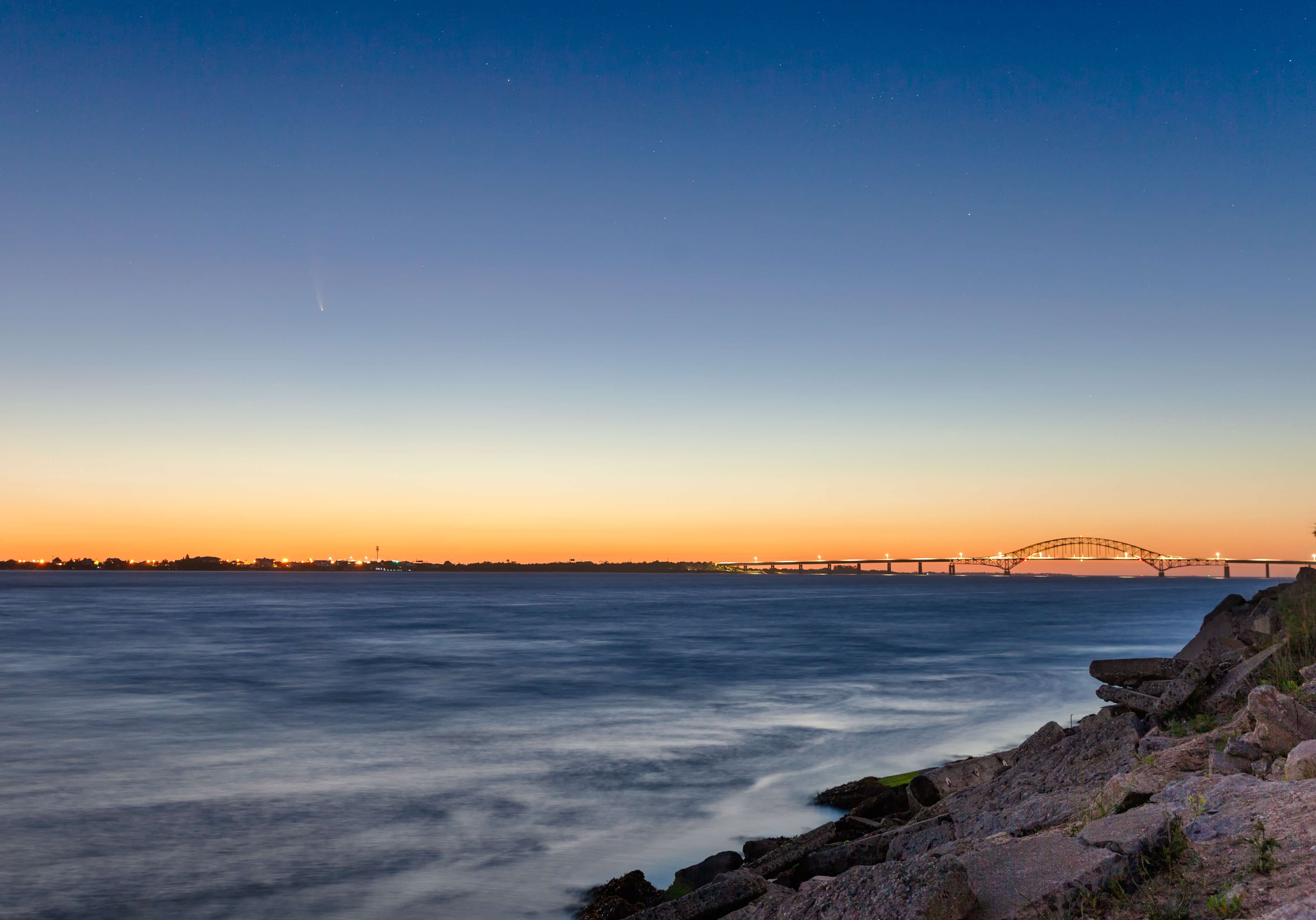 C/2020 F3, or Comet Neowise, rising over the coast in the early morning twilight hours. Fire Island Inlet Bridge - Long Island New York